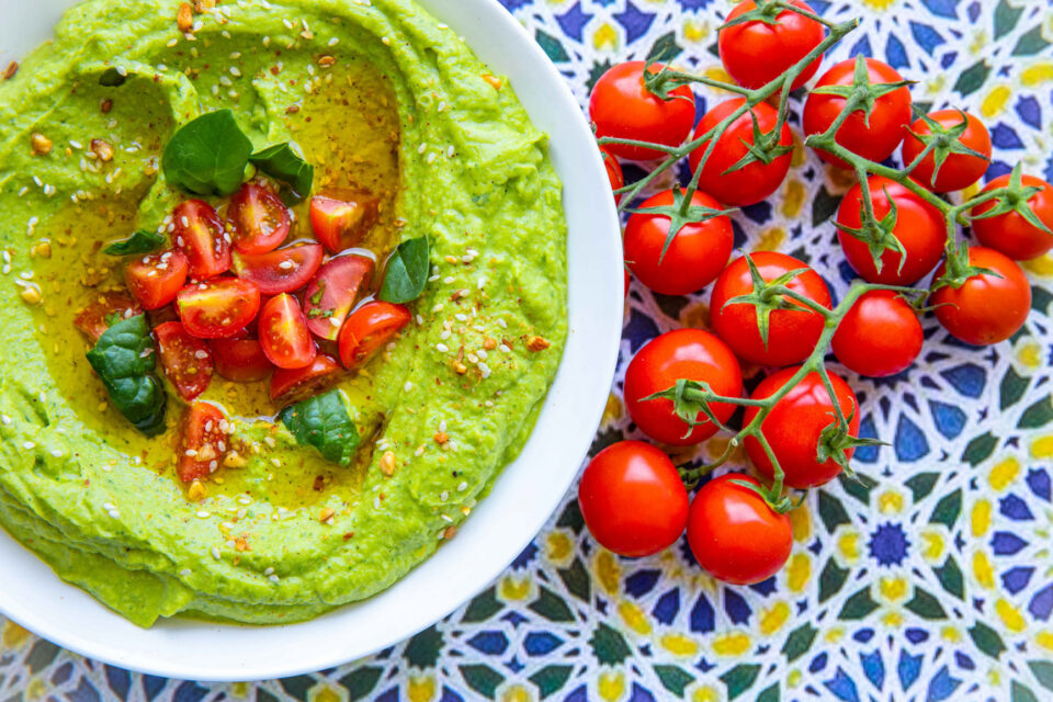 avocado hummus served with cherry tomatoes