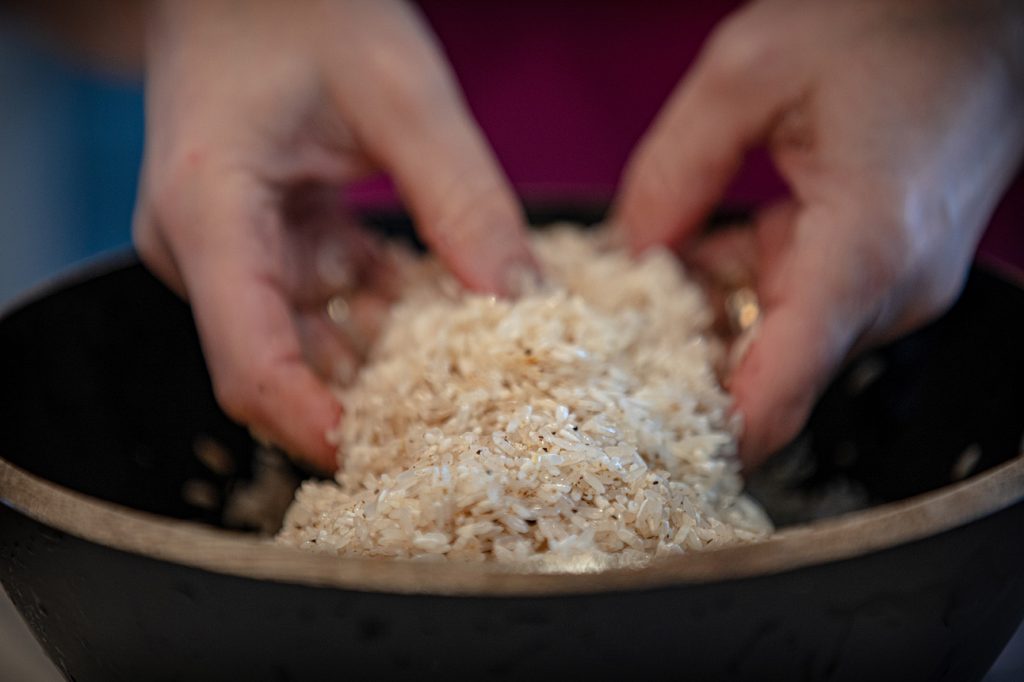 tossing rice with spices