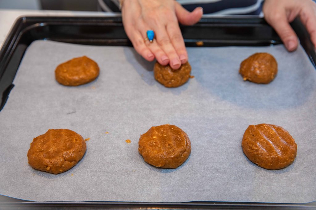 pressing peanut butter cookies gentlygently 