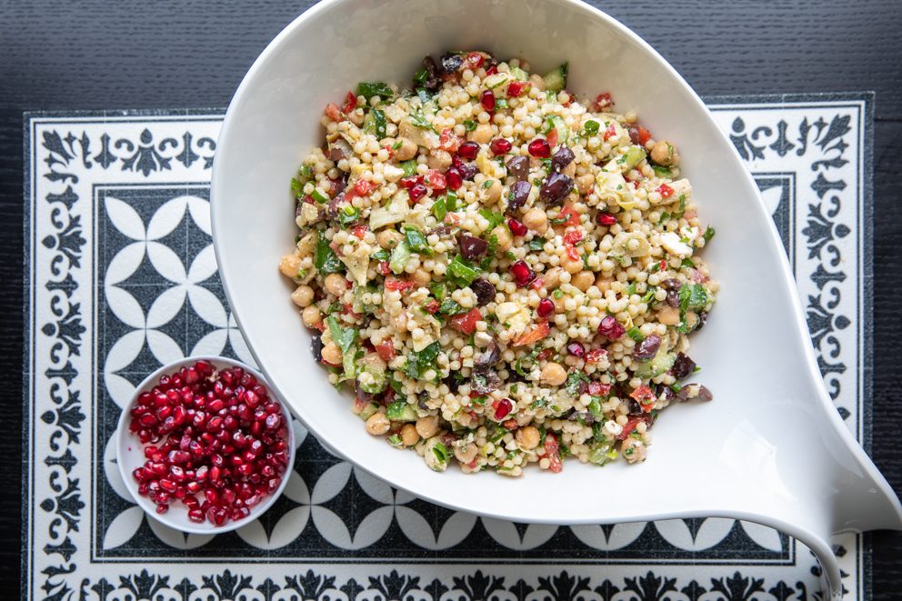 pearl couscous and chickpea salad served in a white bowl