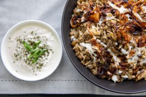 mjadara lentil rice served with yogurt