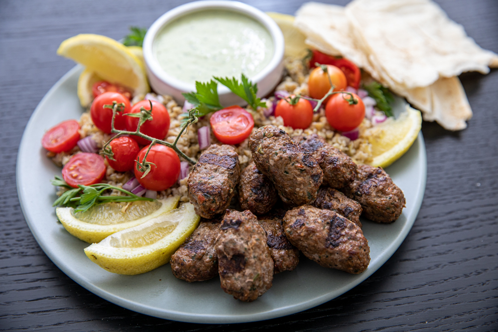 kafta with condiments on a plate